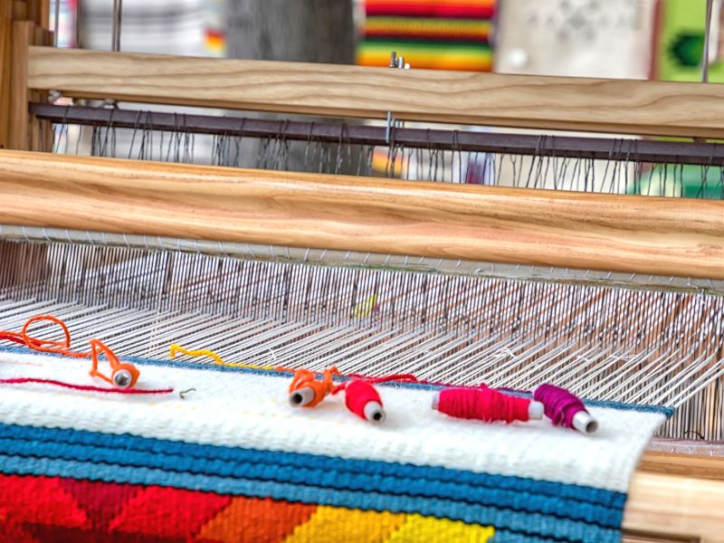 weaving beautiful rug on the loom