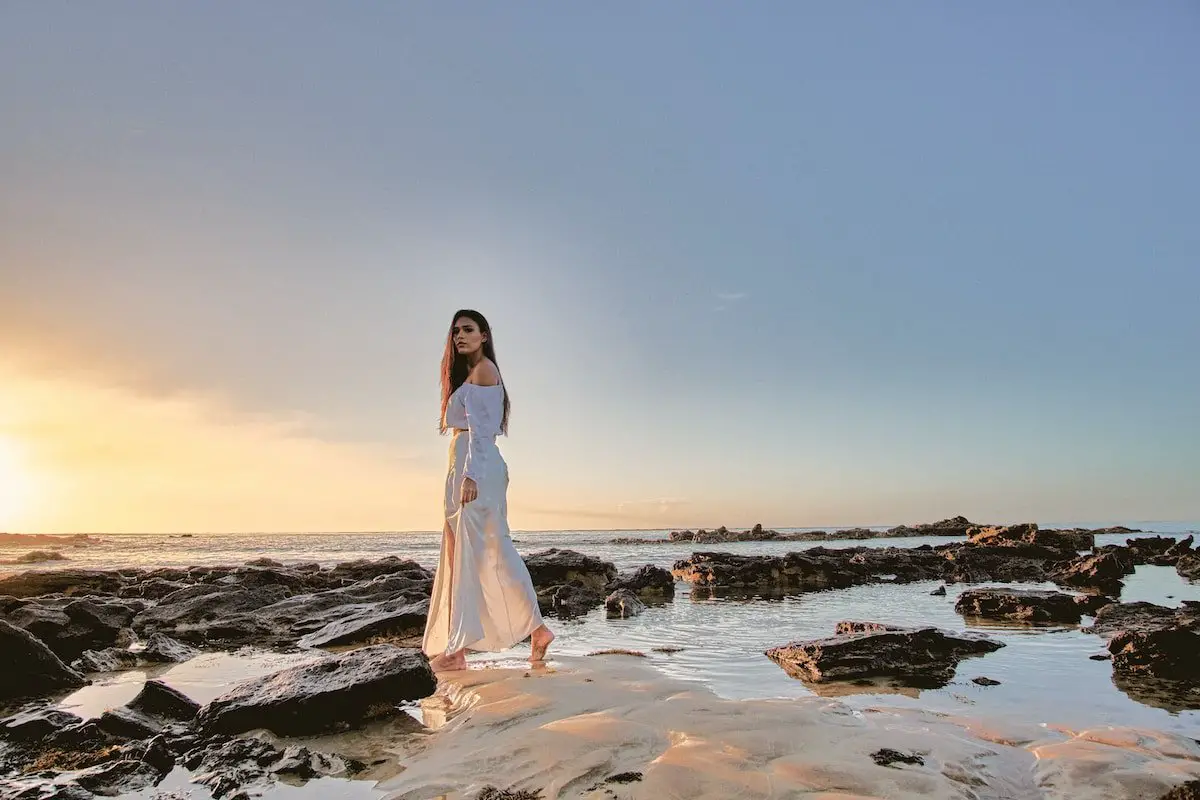 woman standing on body of water